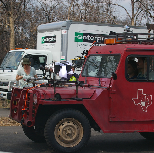 Filming scene of people in Jeep