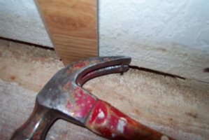 Removing the nail from the wall