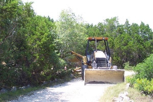 Bulldozer pointed at house