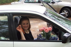 Kathy with flowers and key