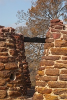 One charred beam remains of the roof