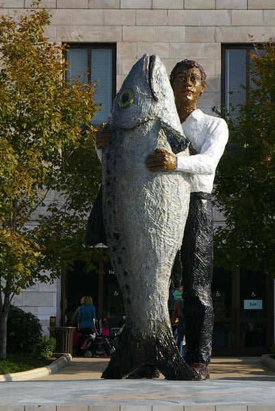 Man and fish statue